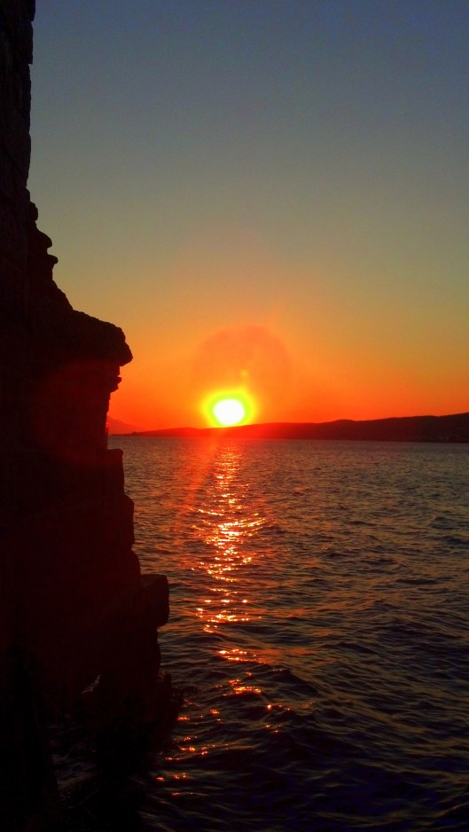 Sunset on the water in Ayvalik, Turkey.